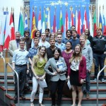 27 member state flags make a colorful backdrop for this photo opportunity for visitor groups.